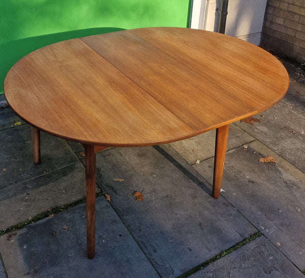 1960s Danish extendable round dining.      SOLD