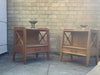 A pair of bedside cabinets by Jacques Adnet