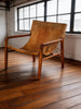 Tan leather sling armchair