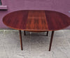 Rosewood round extendable dining table by Mclntosh 1960