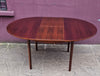 Rosewood round extendable dining table by Mclntosh 1960