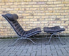 A pair of Ari lounge chairs with ottomans by Arne Norell for Norell Möbel AB,