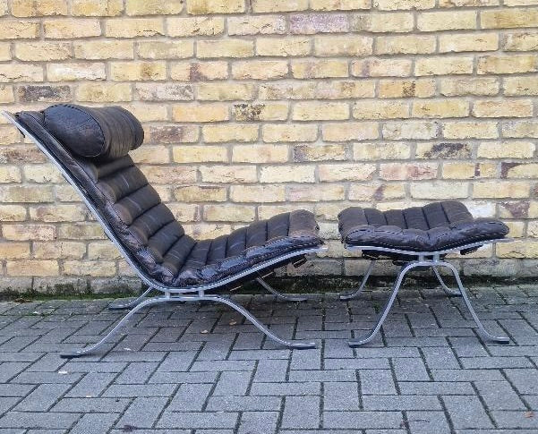 A pair of Ari lounge chairs with ottomans by Arne Norell for Norell Möbel AB,